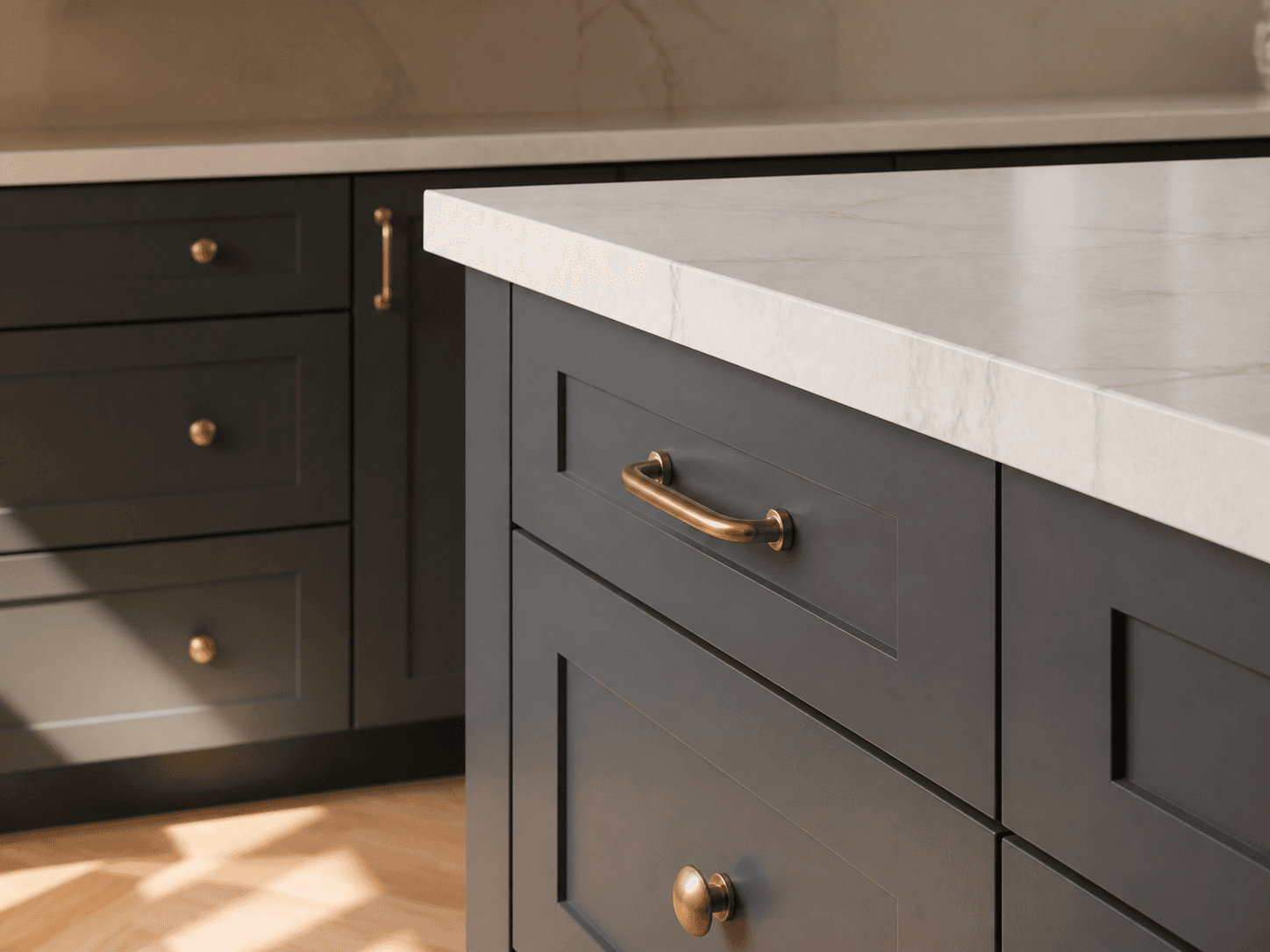 The edge of a marble countertop meeting a charcoal shaker island